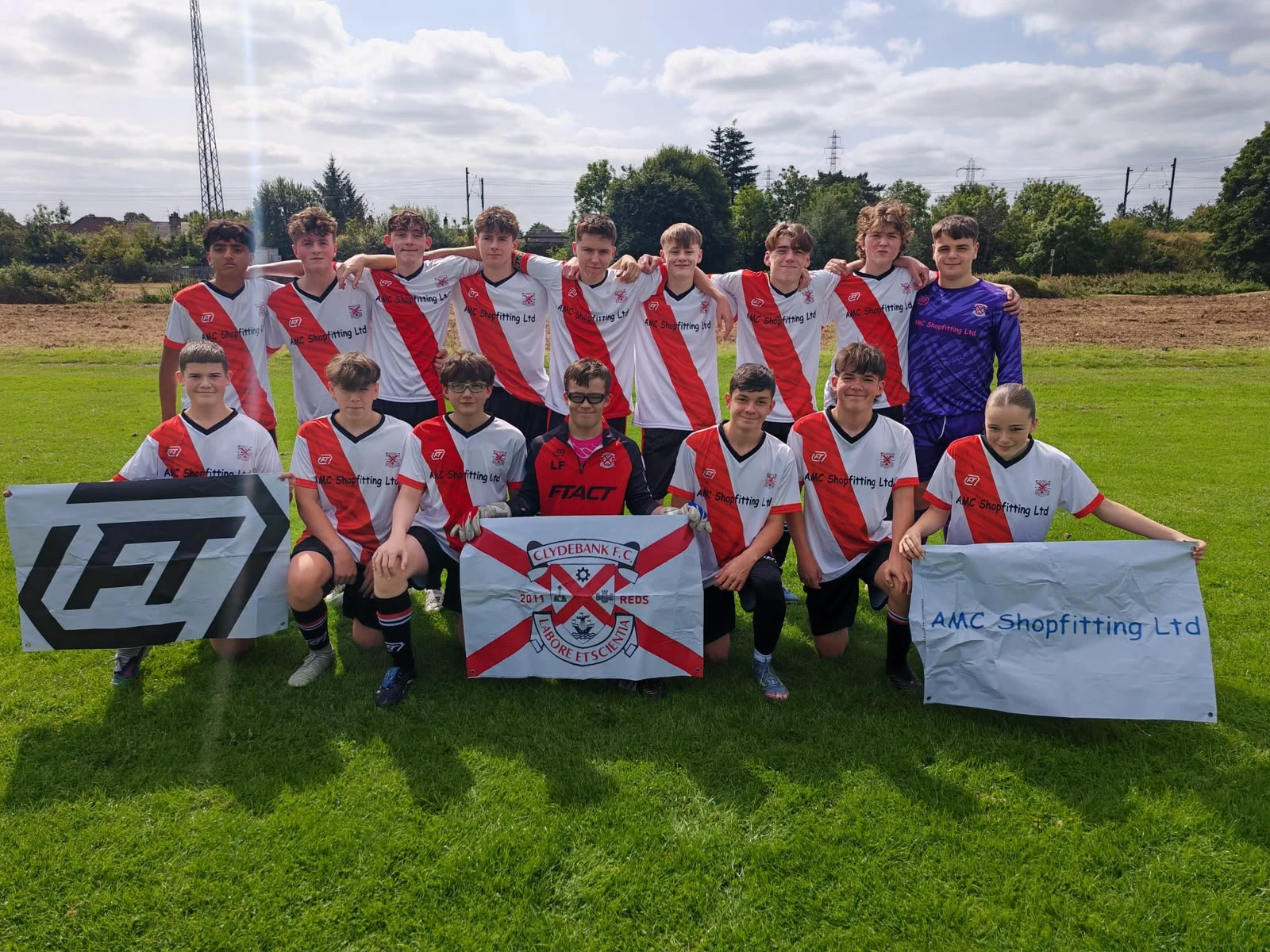 Clydebank squad together in their red and white FTACT kit
